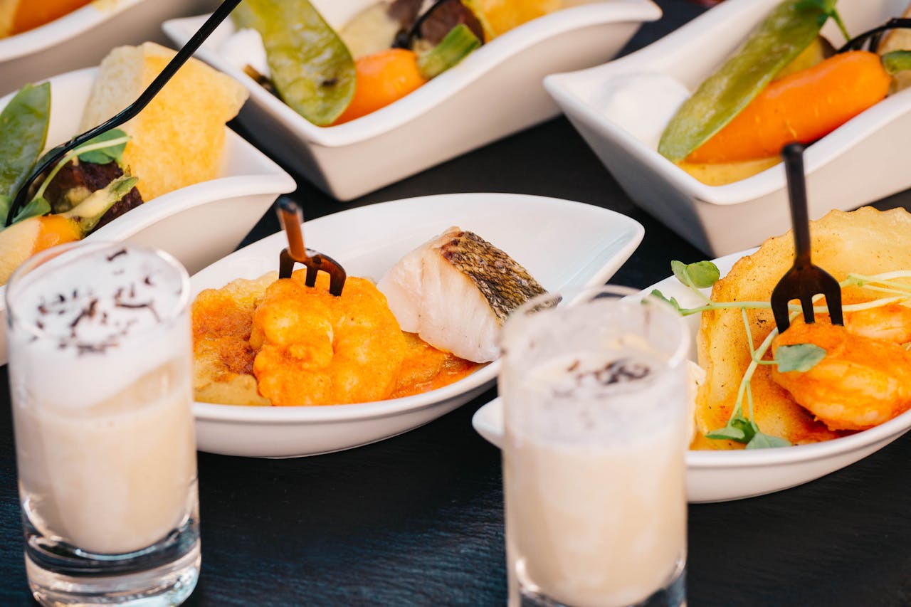 A variety of gourmet dishes beautifully plated with decorative garnishes, perfect for food lovers.